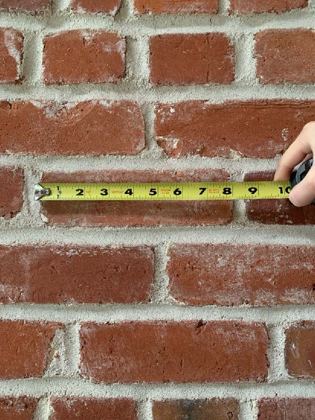 Close up of repointed (repaired mortar) and brick